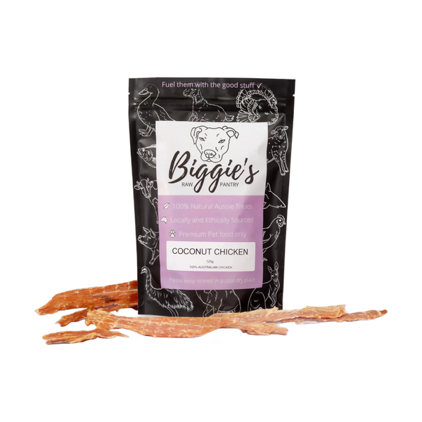 A package of Biggies Coconut Chicken treats is displayed against a neutral background, featuring a black and white design with the product name clearly labeled.