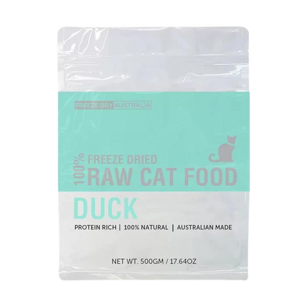 A package of freeze-dried cat food labeled 100% Raw Cat Food Duck prominently features a turquoise and white design. The bag indicates it is 500 grams, 100% natural, protein-rich, and made in Australia, along with a silhouette of a cat.