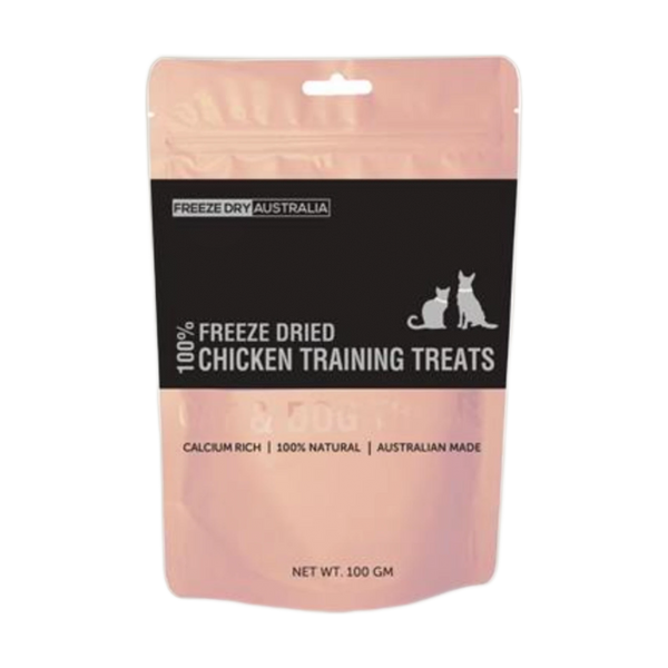 A package of Freeze Dried Chicken Training Treats, featuring a pink background with a black label displaying the product name and information.